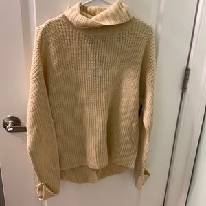 White cowl neck sweater with lace design on back